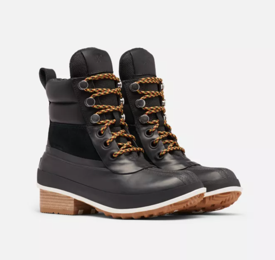 Sorel Hiker Duck Boot in black with brown orange laces (Photo via Sorel)