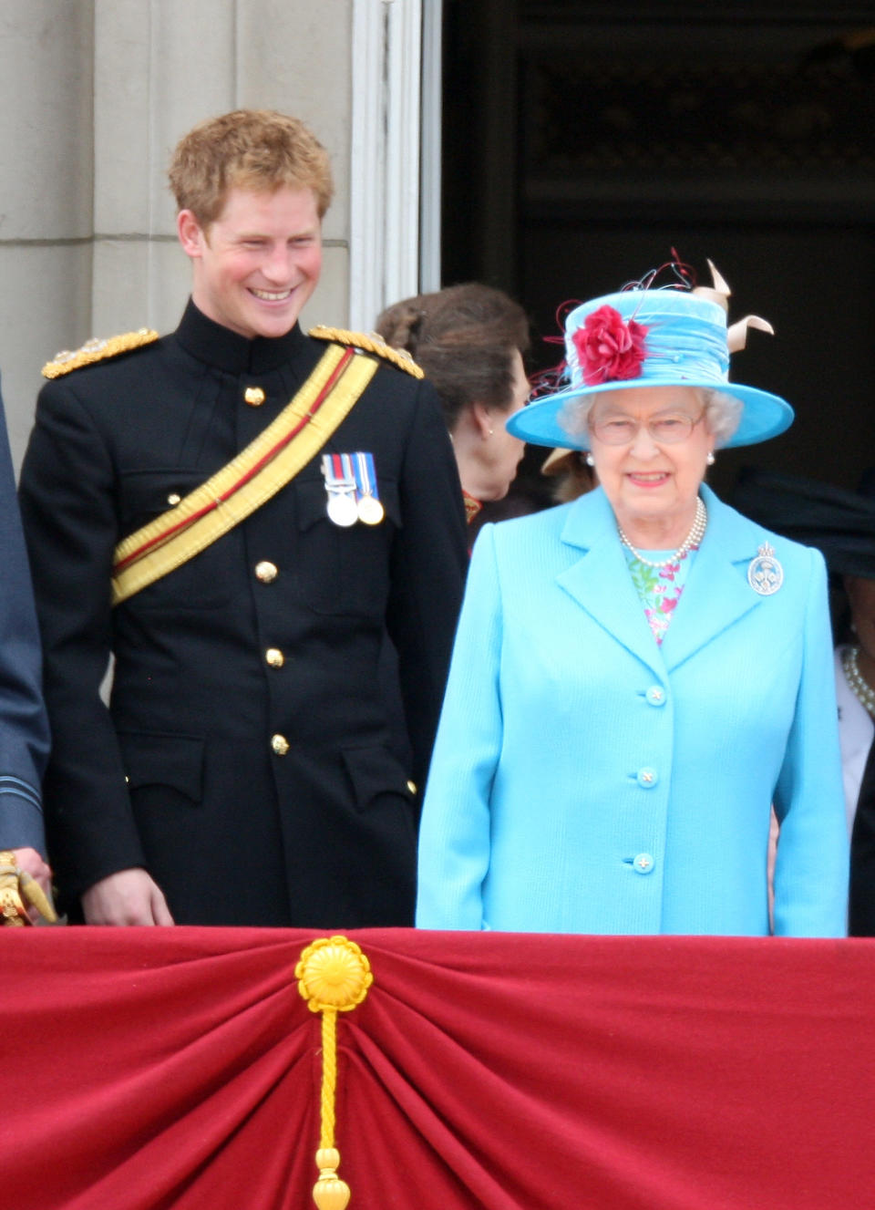 Queen Elizabeth and Prince Harry interacting