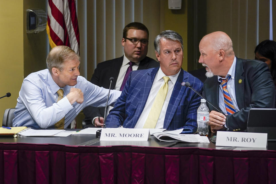 FILE - House Judiciary Committee Chairman Jim Jordan, R-Ohio, left, speaks with Rep. Barry Moore, R-Ala., center, and Rep. Chip Roy, R-Texas, right, during a House Judiciary Committee Field Hearing, April 17, 2023, in New York. Moore is running for the 1st Congressional district seat in Alabama. (AP Photo/John Minchillo, File)