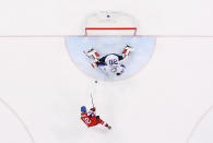 <p>Petr Koukal #42 of the Czech Republic scores the game-winning goal against Ryan Zapolski #30 of the United States in the overtime penalty-shot shootout to win the Men’s Play-offs Quarterfinals 3-2 on day twelve of the PyeongChang 2018 Winter Olympic Games at Gangneung Hockey Centre on February 21, 2018 in Gangneung, South Korea. (Photo by Ronald Martinez/Getty Images) </p>