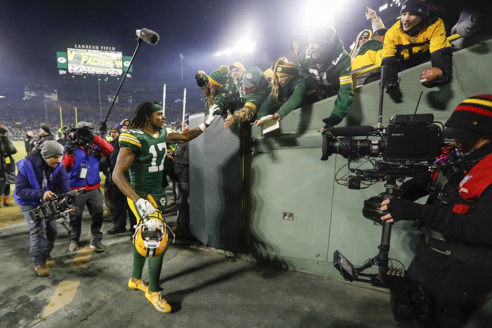 Green Bay Packers' Davante Adams celebrates with fans after an NFL divisional playoff football game against the Seattle Seahawks Sunday, Jan. 12, 2020, in Green Bay, Wis. The Packers won 28-23 to advance to the NFC Championship. (AP Photo/Mike Roemer)