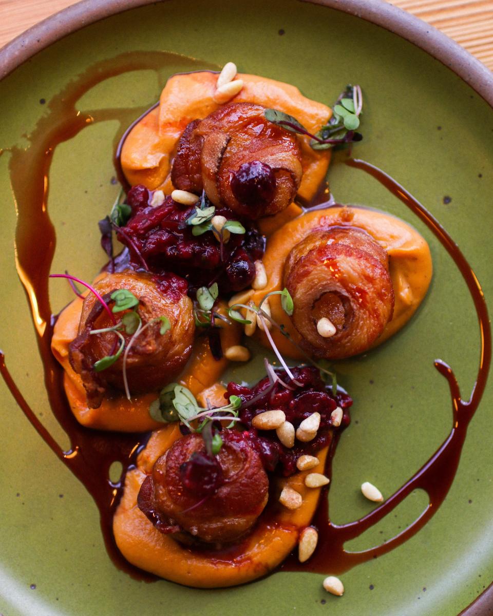 Bacon wrapped scallops are featured on the holiday menu at Chestnut in downtown Asheville.