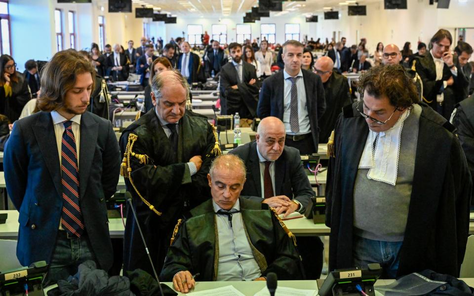 Officials listen to the verdicts in the court in Lamezia Terme, southern Italy