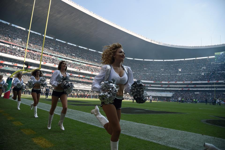 <p>Oakland Raiders´ cheerleaders perform during the 2016 NFL week 11 regular season football game against New England Patriots’ on November 19, 2017 at the Azteca Stadium in Mexico City. / AFP PHOTO / ALFREDO ESTRELLA (Photo credit should read ALFREDO ESTRELLA/AFP/Getty Images) </p>