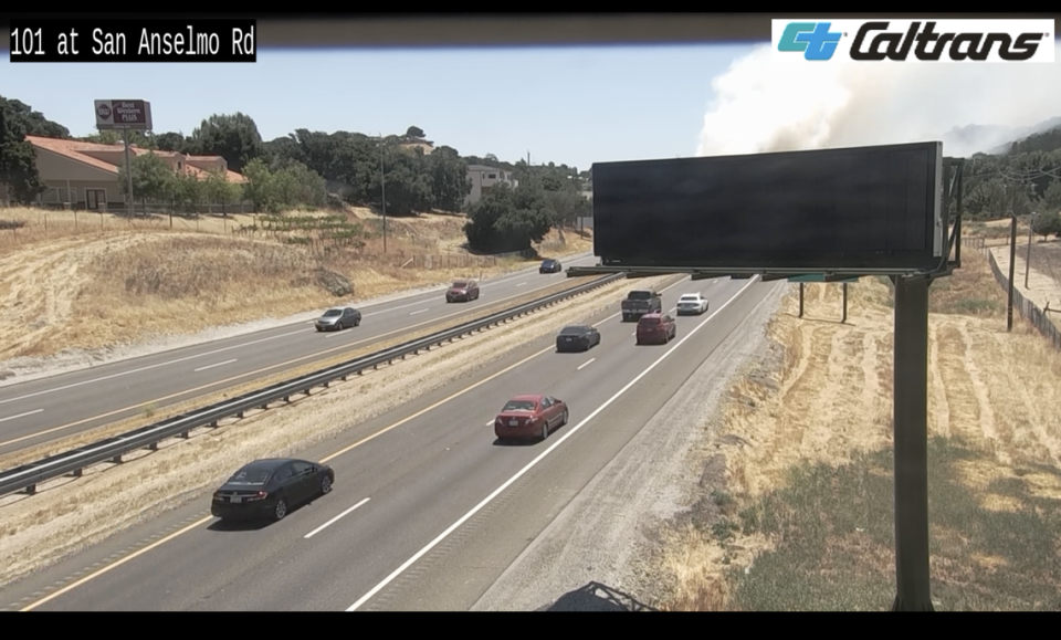 Traffic camera footage along Highway 101 at San Anselmo Road captured a smoke plume from the brush fire on July 15, 2023. Caltrans