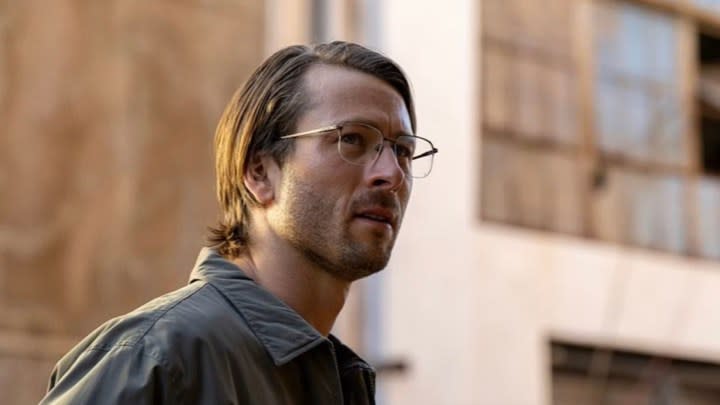 Glen Powell looks nerdy and uncool in a still from Hit Man.