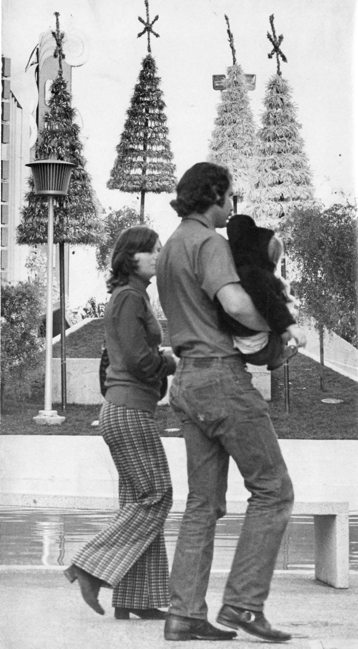 A couple walks past Christmas decorations on the K Street Mall near the Crest Theatre in November 1973. The decorations will be lit despite concerns about an energy shortage. The Sacramento Downtown Association projected a 75% energy savings by turning them on for six hours in the evenings, instead of the past practice of illuminating them 24 hours per day. Bee file/Center for Sacramento History