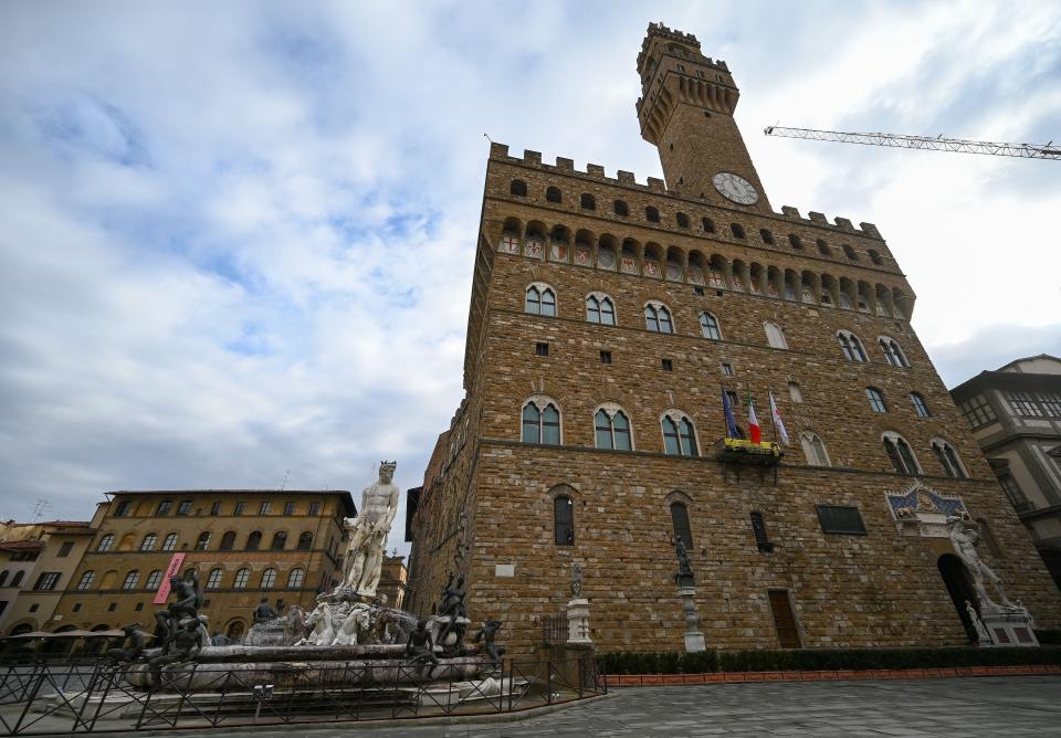 A view shows the Palazzo della Signoria (Palazzo Vecchio) and the Fountain of Neptune (L) on Jan. 21, 2021 in Florence, Tuscany. The 16th century statue is surrounded by a short barrier.