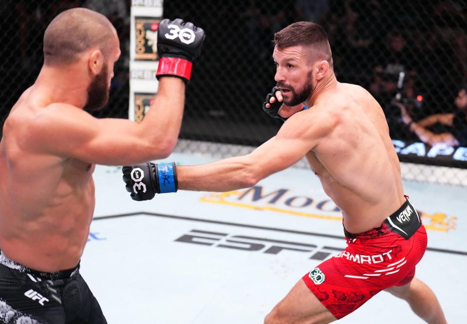 LAS VEGAS, NEVADA – SEPTEMBER 23: (R-L) Mateusz Gamrot of Poland battles Rafael Fiziev of Kazakstan in a lightweight fight during the UFC Fight Night event at UFC APEX on September 23, 2023 in Las Vegas, Nevada. (Photo by Chris Unger/Zuffa LLC via Getty Images)