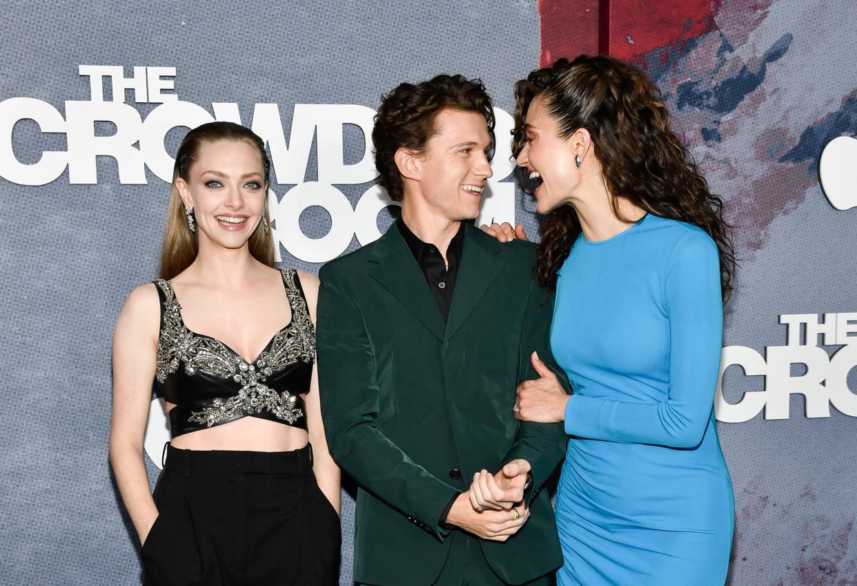 Amanda Seyfried, left, Tom Holland and Emmy Rossum attend the Apple TV+ limited series premiere of "The Crowded Room" at the Museum of Modern Art on Thursday, June 1, 2023, in New York. (Photo by Evan Agostini/Invision/AP) ORG XMIT: NYEA214