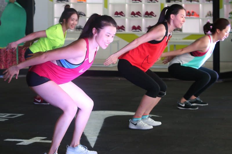 Chinese women participate in a Nike-sponsored, public fitness workout and demonstration in the plaza of an international shopping mall in Beijing in 2016. Chinese malls are being used for more than shopping. File Photo by Stephen Shaver/UPI