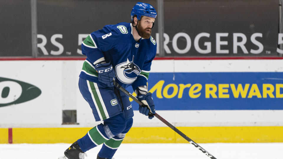 VANCOUVER, BC - MARCH 08: Jordie Benn #8 of the Vancouver Canucks skates with the puck during NHL hockey action against the Montreal Canadiens at Rogers Arena on March 8, 2021 in Vancouver, Canada. (Photo by Rich Lam/Getty Images)