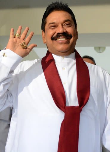 Sri Lankan President Mahinda Rajapakse gestures after the presentation of the 2013 budget at the parliament in Colombo on November 8. Shirani Bandaranayake, the first woman to be Sri Lanka's top judge, went before a Parliamentary Select Committee (PSC) for the first time to answer allegations of financial and official misconduct, sources said