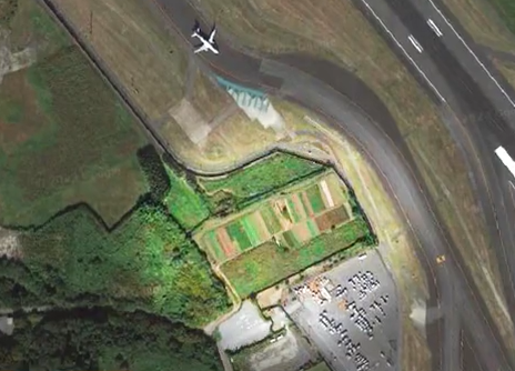 One of Narita's runways had to be built around Takao Shito's farm.  / Credit: CBS News