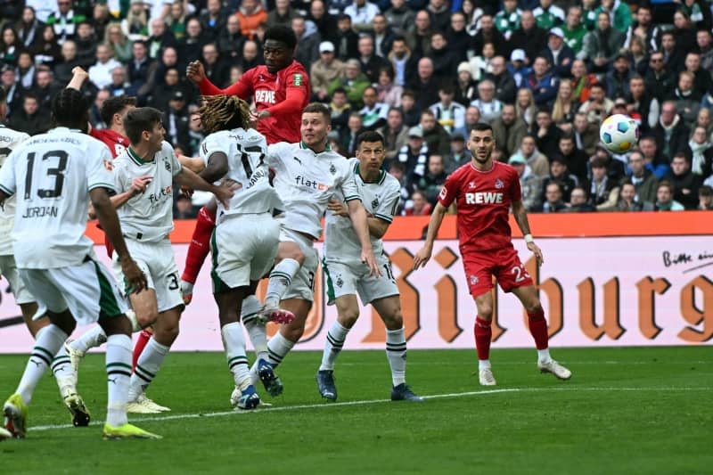 Cologne's Faride Alidou (4th L) scores the his side's second goal of the game during the German Bundesliga Soccer match between Borussia Moenchengladbach and 1. FC Colone at the Borussia-Park. Federico Gambarini/dpa