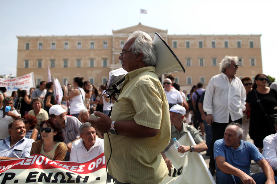 Pensioners take part in a rally against healthcare cuts in front of the parliament, in Athens, on Saturday, Sept. 8, 2012. Greece, in the grip of a severe recession for the fifth straight year, is still struggling to avoid bankruptcy by imposing harsh austerity measures, including wage and pension cuts, with unemployment increasing to nearly a quarter of the workforce.(AP Photo/Petros Giannakouris)