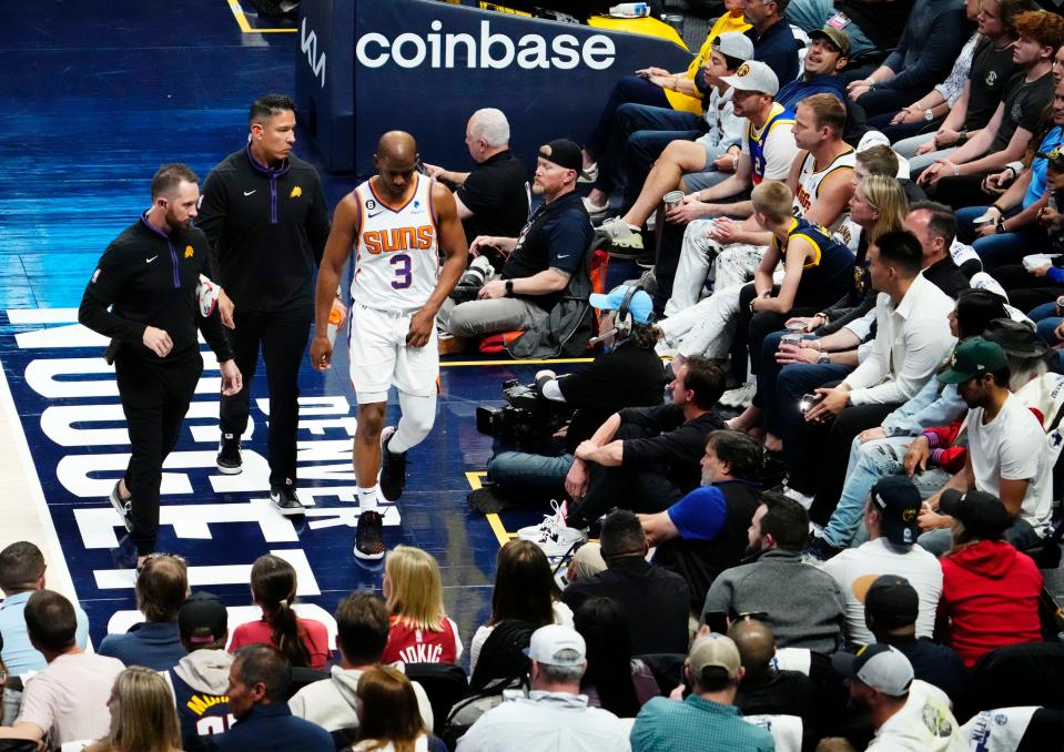 Phoenix Suns guard Chris Paul (3) leaves the game with a groin injury against the Denver Nuggets in the third quarter during Game 2 of the Western Conference Semifinals at Ball Arena in Denver on May 1, 2023.