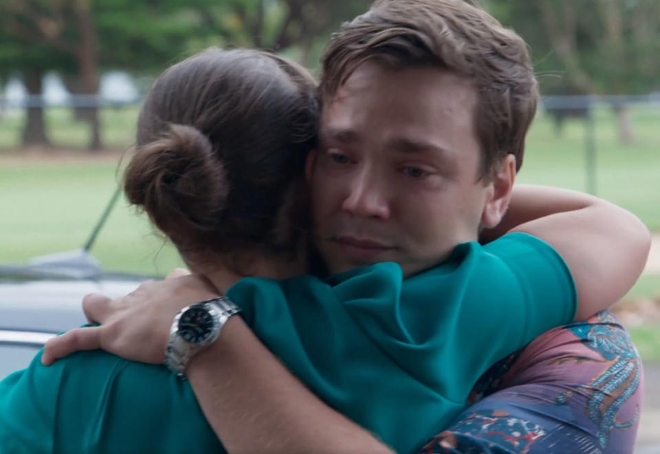 Ryder Jackson hugs Bella Nixon goodbye on his last episode of Home and Away. He has tears in his eyes.