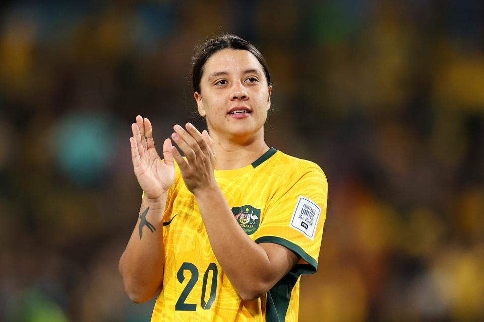 Sam Kerr of Australia applauds fans after advancing to the quarterfinals on August 07.