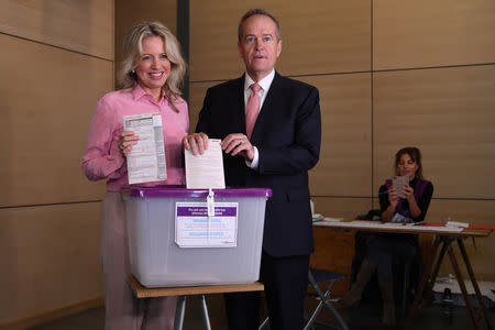 Australian Opposition Leader Bill Shorten and his wife Chloe are seen casting their votes at Moonee Ponds West Primary school in Melbourne, Australia, May 18, 2019. AAP Image/Lukas Coch/via REUTERS