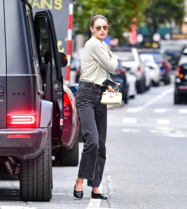 Gigi Hadid wearing a black backpack