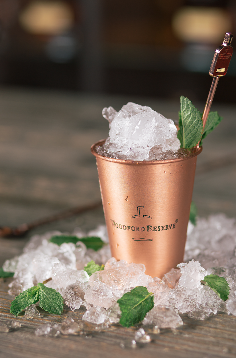 <p><strong>Ingredients</strong></p><p>2 oz Woodford Reserve <br>1 oz water <br>4 sprigs of fresh mint <br>1 tsp sugar <br>Crushed ice </p><p><strong>Instructions </strong></p><p>In a copper julep cup rub 2 pieces of fresh mint around the cup to express the oils. Add Woodford Reserve, then the water and sugar and stir with a bar spoon. Add crushed ice to the top then garnish with sprigs of mint. </p><p><strong>More</strong>: <a href="https://www.townandcountrymag.com/leisure/drinks/news/a6026/history-of-the-mint-julep/" rel="nofollow noopener" target="_blank" data-ylk="slk:A Complete History of the Mint Julep;elm:context_link;itc:0;sec:content-canvas" class="link ">A Complete History of the Mint Julep</a></p>