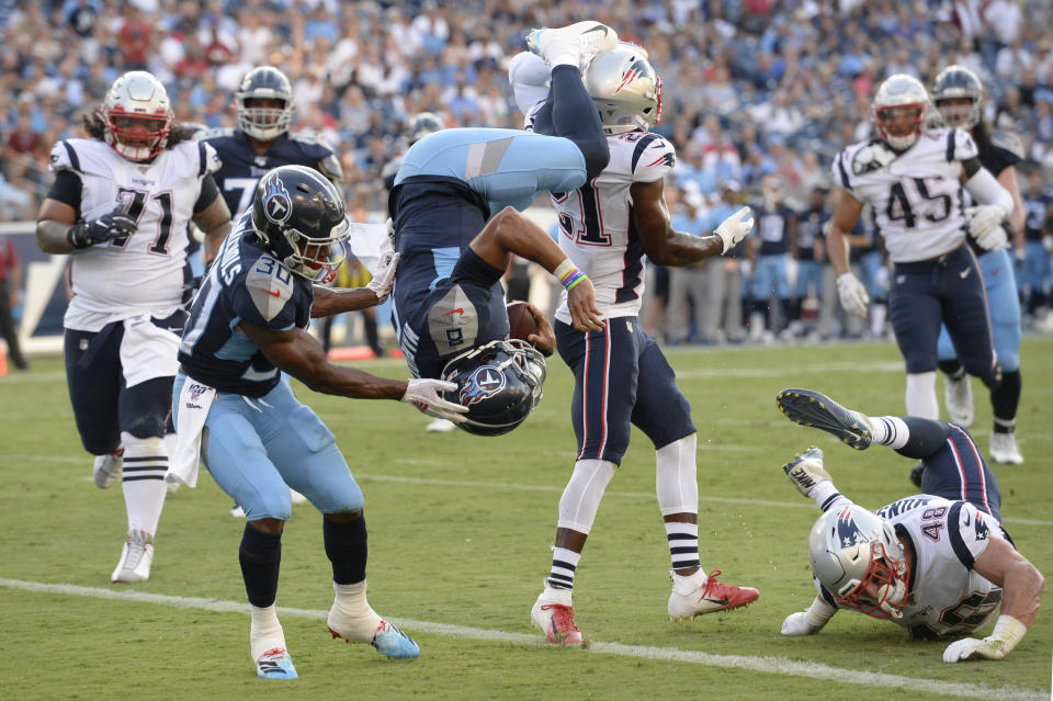 Tennessee Titans quarterback Marcus Mariota (8) flips into the end zone as he converts a two-point conversion against the New England Patriots. (AP)