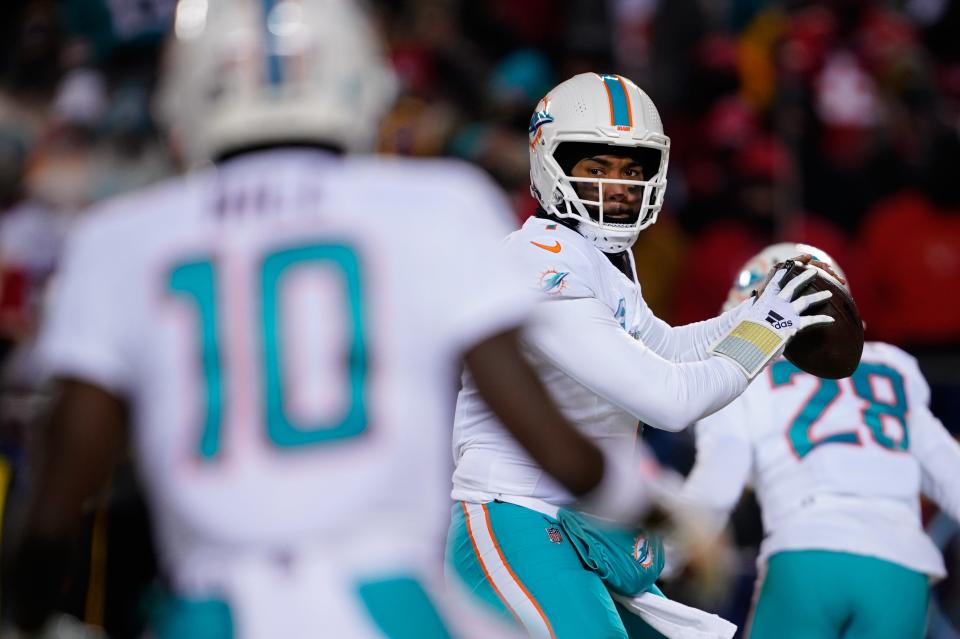 Jan 13, 2024; Kansas City, Missouri, USA; Miami Dolphins quarterback Tua Tagovailoa (1) drops back to pass against the Kansas City Chiefs during the first half of the 2024 AFC wild card game at GEHA Field at Arrowhead Stadium. Mandatory Credit: Jay Biggerstaff-USA TODAY Sports