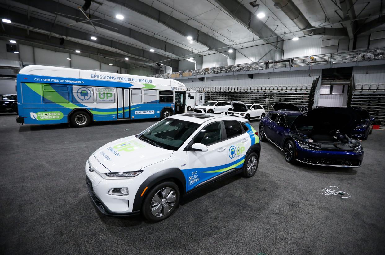 Electric vehicles at during setup for the first Springfield Auto Show at the Wilson Logistics Arena at the Ozark Empire Fairgrounds on Thursday, Nov. 2, 2023.