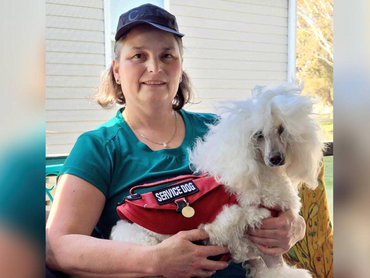 Vita Stiebert of Durham, Ont., carries a doctor's note that says her physician believes her service dog, Amora, is necessary for medical reasons. (Submitted by Vita Stiebert - image credit)