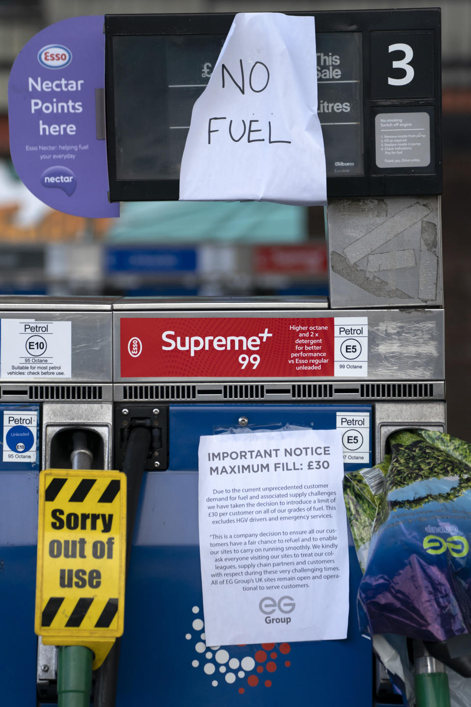 Closed pumps are seen on the forecourt of a petrol station in Manchester which has run out of fuel after an outbreak of panic buying in the UK, Monday, Sept. 27, 2021. British Prime Minister Boris Johnson is said to be considering whether to call in the army to deliver fuel to petrol stations as pumps ran dry after days of panic buying. ( AP Photo/Jon Super)