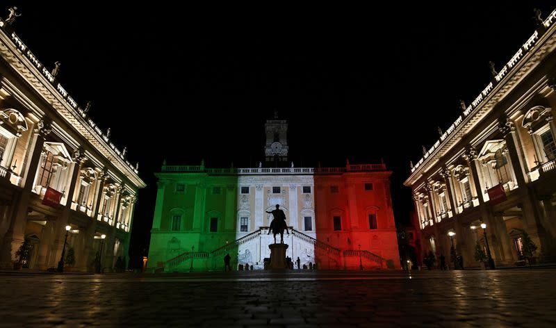 FILE PHOTO: Rome's Town Hall is lit up with the colours of the Italian flag to show solidarity with the country as it continues to battle coronavirus, in Rome