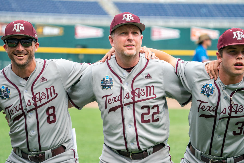 Jun 21, 2022; Omaha, NE; Texas A&M head coach Jim Schlossnagle (22) celebrates the win over the Notre Dame Fighting Irish at Charles Schwab Field. Dylan Widger-USA TODAY Sports