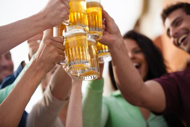 Group of Attractive young People toasting with a delicious Pale Ale  Beer