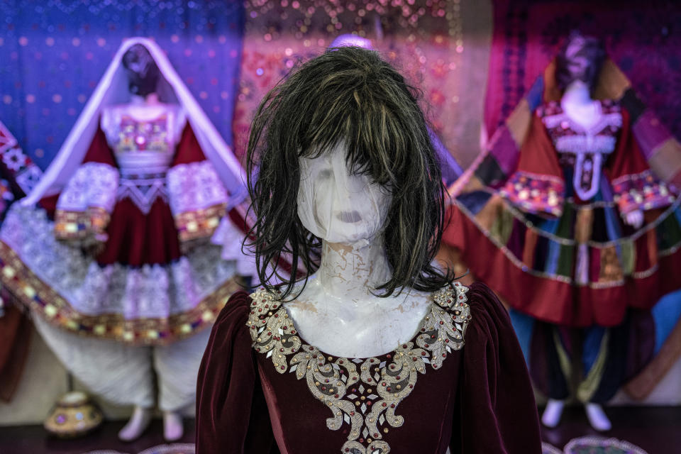 A mannequin's head is covered in a woman dress shop in Kabul, Afghanistan, Monday, Dec. 26, 2022. Under the Taliban, the mannequins in women's dress shops across the Afghan capital Kabul are a haunting sight, their heads cloaked in cloth sacks or wrapped in black plastic bags. The hooded mannequins are one symbol of the Taliban's puritanical rule over Afghanistan (AP Photo/Ebrahim Noroozi)