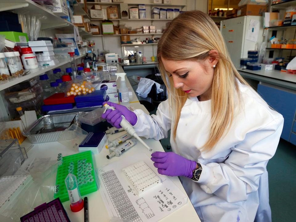 Graduate student Katie Bates works in the Nanomedicine Lab at UCL's School of Pharmacy in London May 2, 2013. Is nanomedicine the next big thing? A growing number of top drug companies seem to think so. The ability to encapsulate potent drugs in nanoparticles measuring billionths of a metre in diameter is opening up new options for super-accurate drug delivery, increasing precision hits at the site of disease with, hopefully, fewer side effects. Photograph taken on May 2, 2013. REUTERS/Suzanne Plunkett (BRITAIN - Tags: BUSINESS EDUCATION HEALTH SOCIETY SCIENCE TECHNOLOGY)