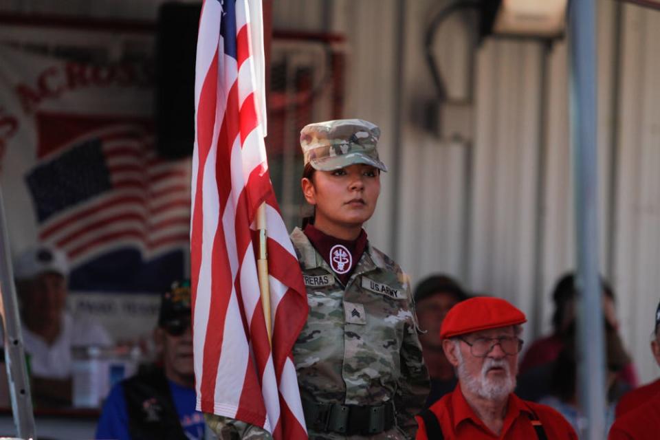 A soldier holds a flag at the El Paso Old Glory Memorial's annual Flag Day ceremony on Wednesday. It also marked the memorial's 20th anniversary.