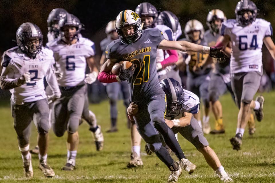 Abingdon-Avon senior wide receiver Clay Slagel breaks away from the Annawan/Wethersfield defense for a long run after a pass reception during the Tornadoes' 14-8 win over the Titans in the opening round of the Class 1A playoffs on Friday, Oct. 29. 2021 at Don Viar Memorial Field.