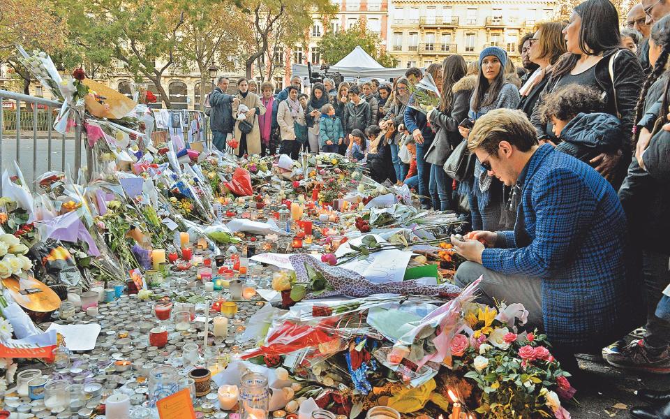 Mourners gather near the scene - AFP via Getty Images