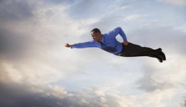 Businessman flying in the sky