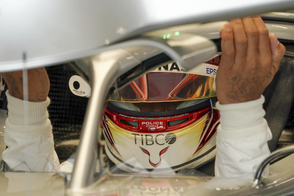 Mercedes driver Lewis Hamilton of Britain prepares for the first practice session at the Marina Bay City Circuit ahead of the Singapore Formula One Grand Prix in Singapore, Friday, Sept. 20, 2019. (AP Photo/Vincent Thian)