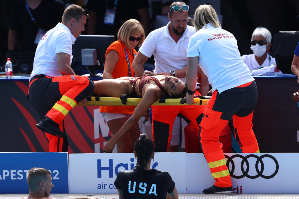 Anita Alvarez, pictured here being attended to by medical staff after she was dragged out of the pool.