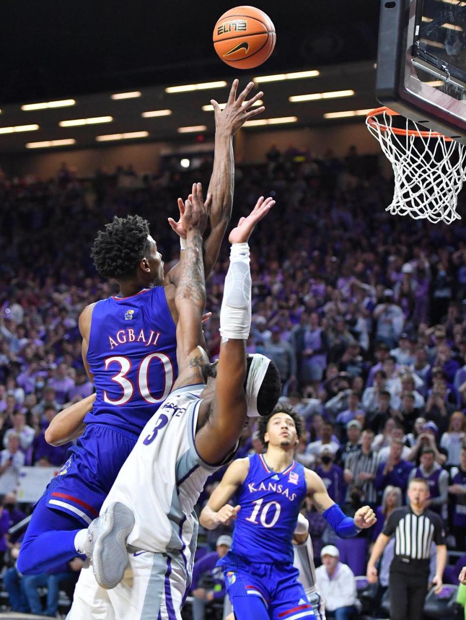 KU’s Ochai Agbaji put the Jayhawks up to stay when he made this basket over K-State’s Selton Miguel late in the second half of Saturday’s Big 12 Conference game at Bramlage Coliseum.