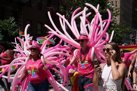 Participants take part in the LGBT Pride March in the Manhattan borough of New York City, U.S., June 25, 2017. REUTERS/Carlo Allegri