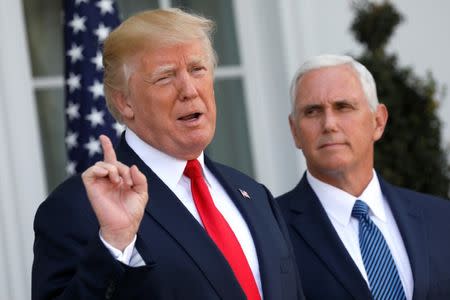 U.S. President Donald Trump speaks to reporters with Vice President Mike Pence at his side at Trump's golf estate in Bedminster, New Jersey U.S. August 10, 2017. REUTERS/Jonathan Ernst