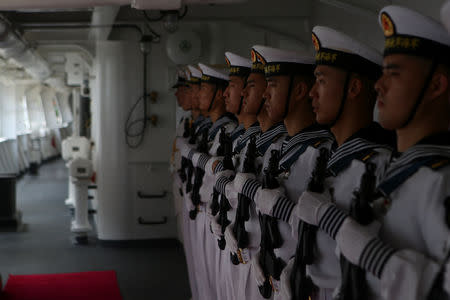 Members of the Chinese People Liberation Army Navy stand at the China's People's Liberation Army (PLA) Navy hospital ship Peace Ark, during its arrival ceremony at the port in La Guaira, Venezuela September 22, 2018. REUTERS/Manaure Quintero