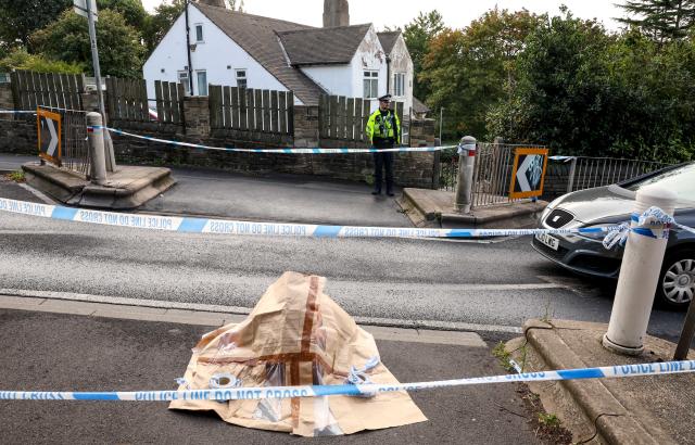 Police cordon near the scene in Woodhouse Hill, Huddersfield, where a 15-year-old boy was stabbed and later died in hospital on Wednesday. Picture date: Thursday September 22, 2022.