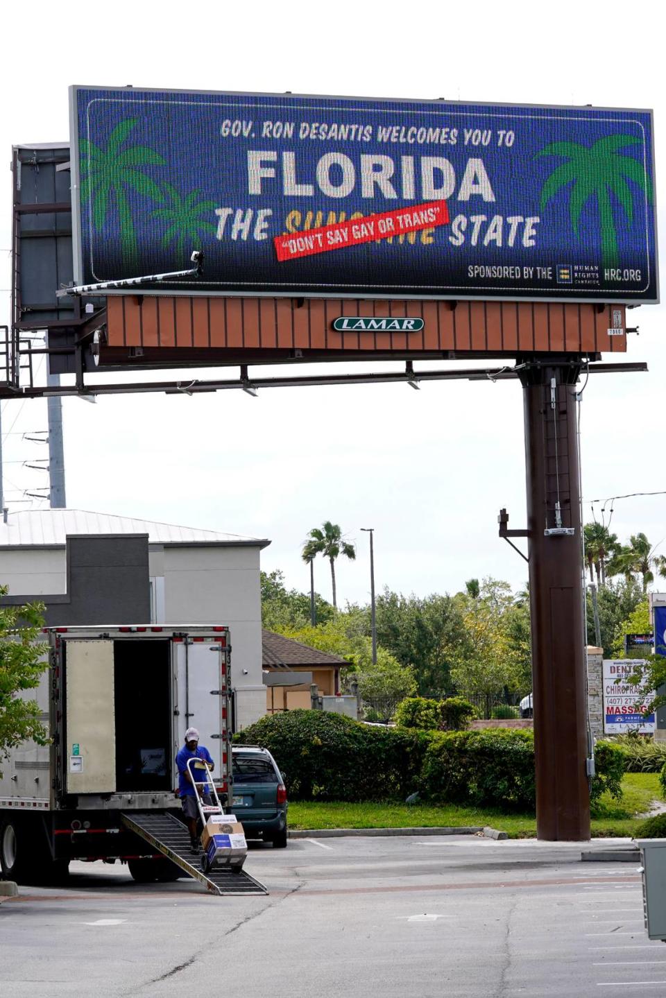 A new billboard welcoming visitors to “Florida: The Sunshine ‘Don’t Say Gay or Trans’ State” is displayed April 21, 2022, in Orlando. The Florida Legislature has passed a bill to dissolve a private government controlled by Disney that provides municipal-like services for its 27,000 acres in the Sunshine State.