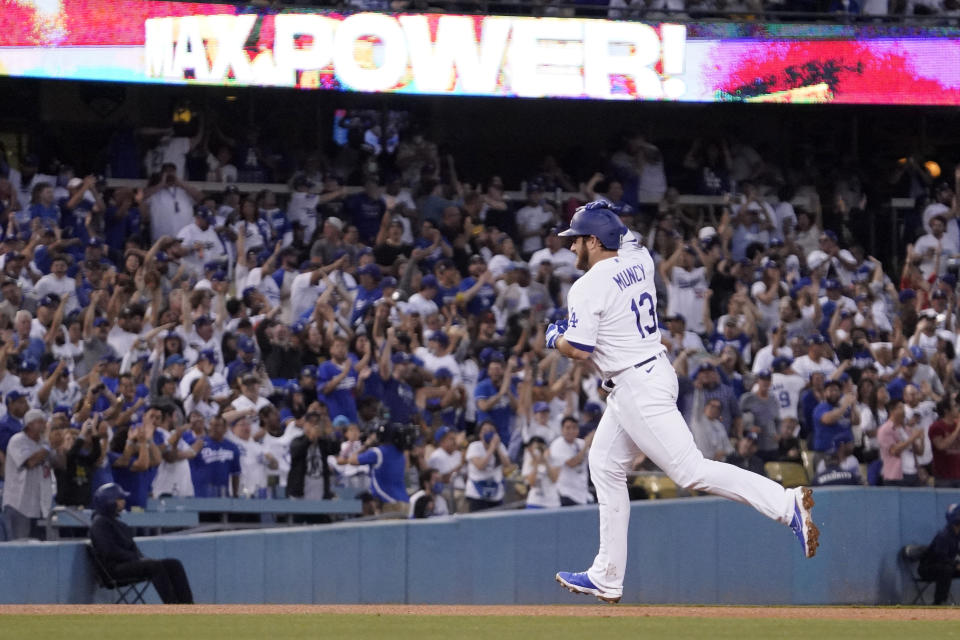 Los Angeles Dodgers' Max Muncy gestures as he rounds third after hitting a solo home run during the third inning of a baseball game against the San Francisco Giants Tuesday, June 29, 2021, in Los Angeles. (AP Photo/Mark J. Terrill)