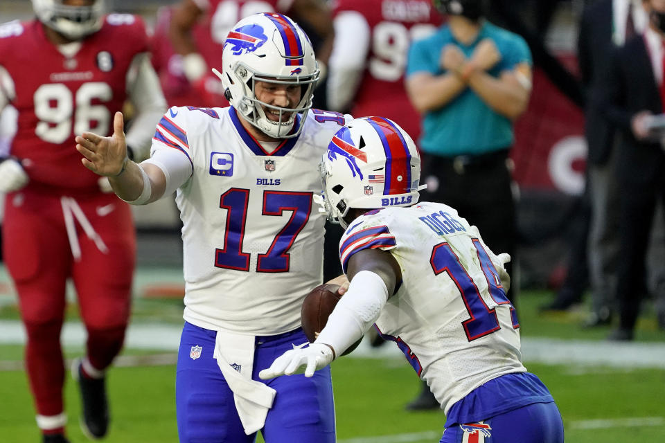 Buffalo Bills quarterback Josh Allen (17) celebrates his touchdown with wide receiver Stefon Diggs (14) 